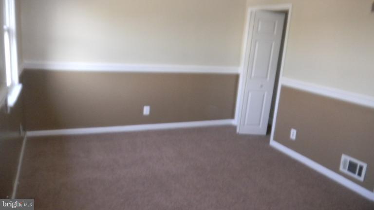 419 Oakwood Road Baltimore, MD 21222 - Photo 8 of 16 a view of an empty room