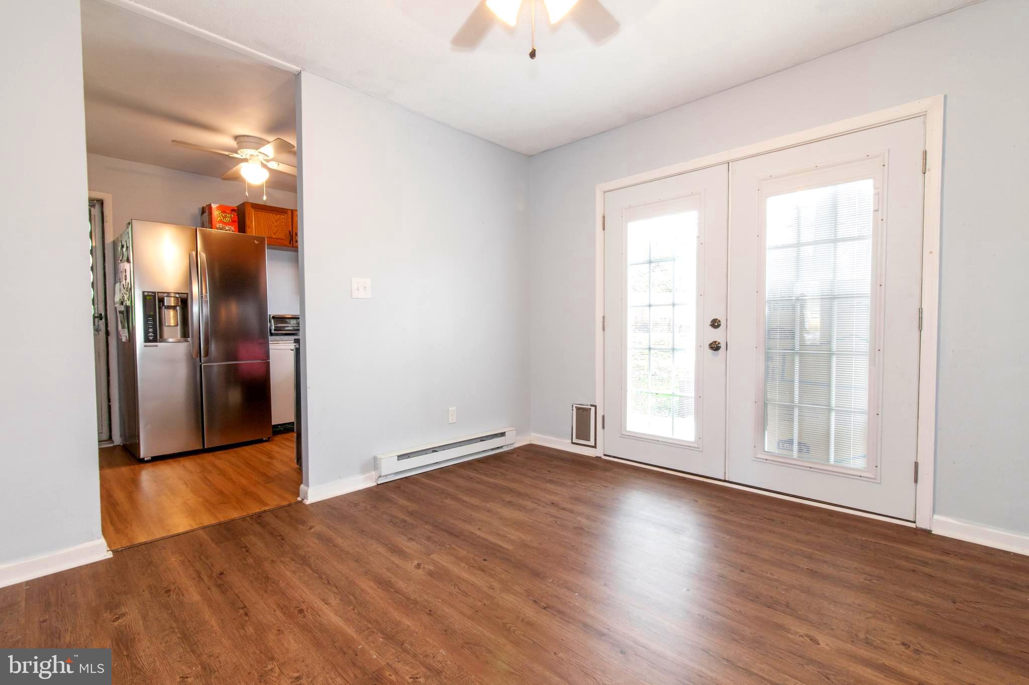806 Chatfield Road Joppa, MD 21085 - Photo 11 of 28 New french doors w/internal shades and doggie dog