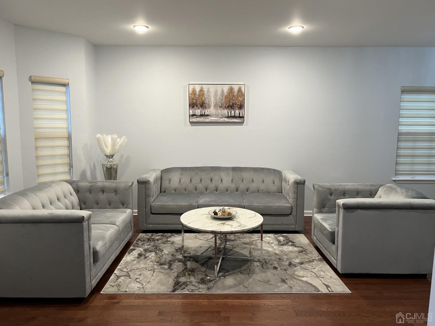 116 B Street Port Reading, NJ 07064 - Photo 2 of 30 a living room with a couch and a table