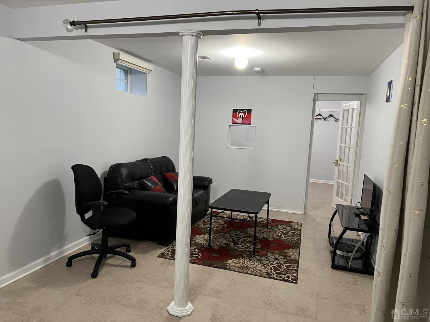 116 B Street Port Reading, NJ 07064 - Photo 21 of 30 a view of a workspace with furniture and a window