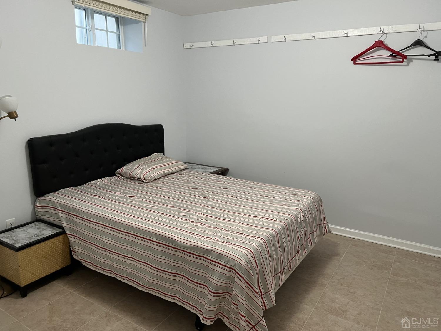 116 B Street Port Reading, NJ 07064 - Photo 22 of 30 a bedroom with a bed and a couch