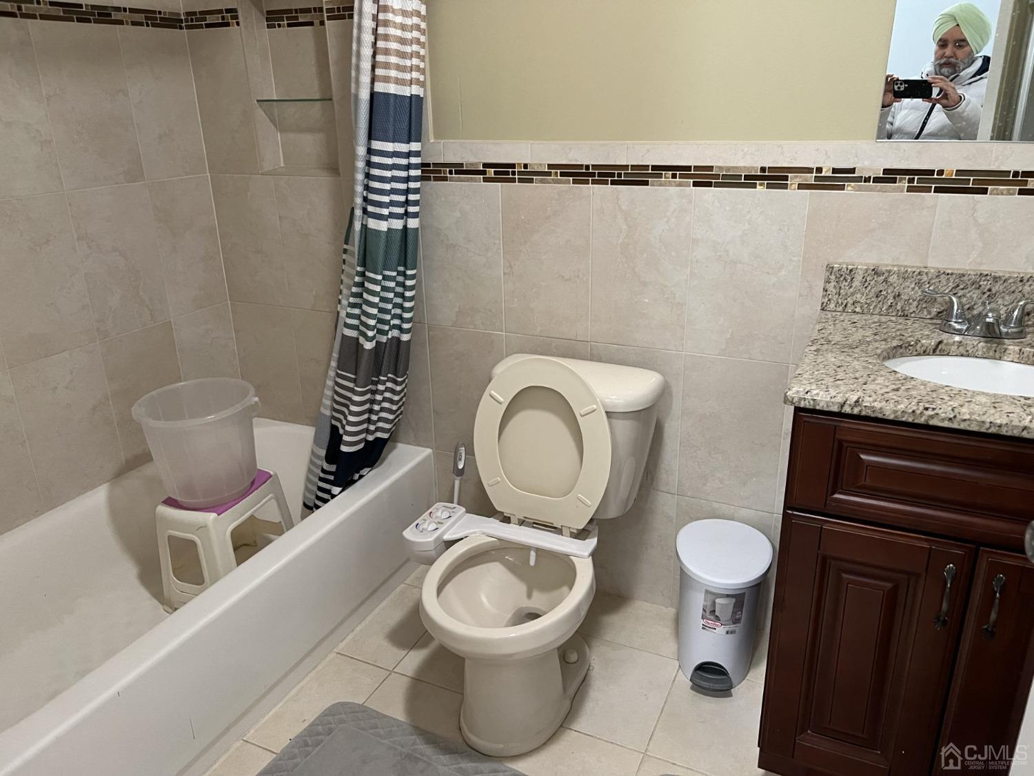 116 B Street Port Reading, NJ 07064 - Photo 23 of 30 a bathroom with a toilet a sink and a mirror