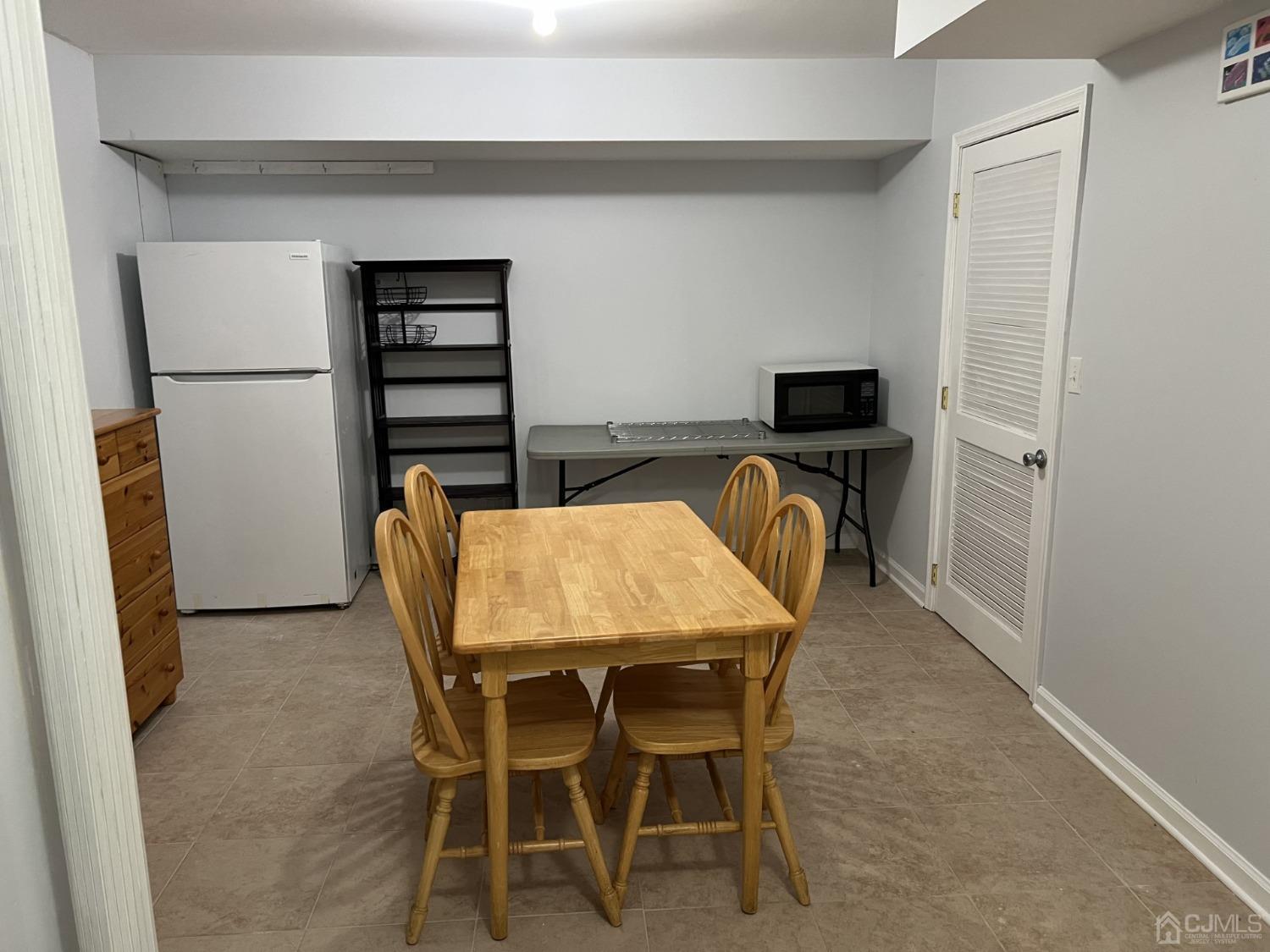 116 B Street Port Reading, NJ 07064 - Photo 24 of 30 a dining room with furniture and wooden floor