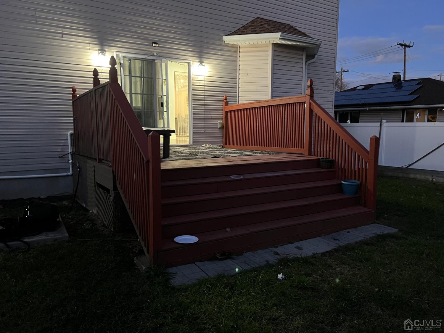 116 B Street Port Reading, NJ 07064 - Photo 29 of 30 a view of backyard with deck and wooden tub