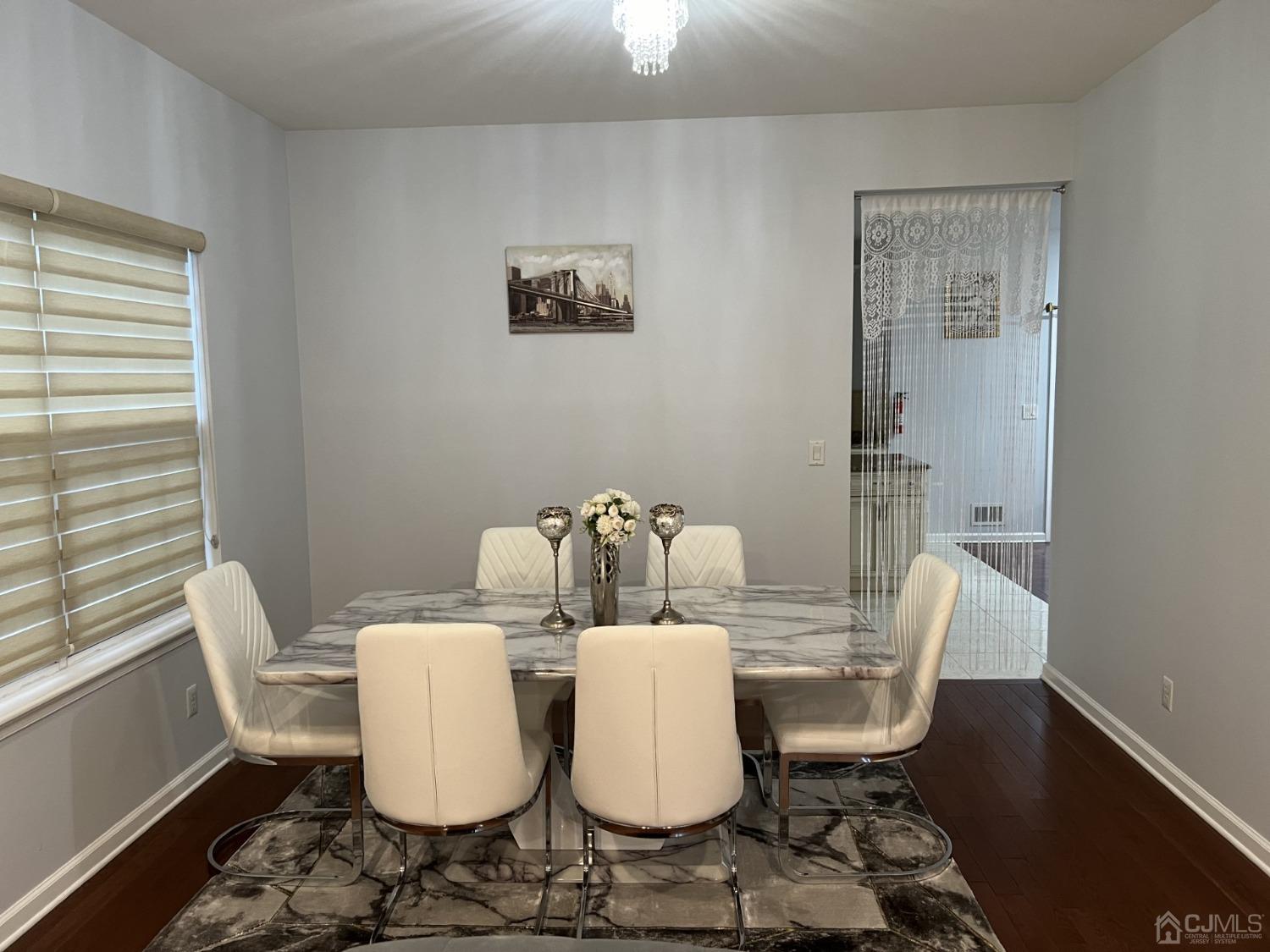 116 B Street Port Reading, NJ 07064 - Photo 3 of 30 a view of a dining room with furniture window and wooden floor