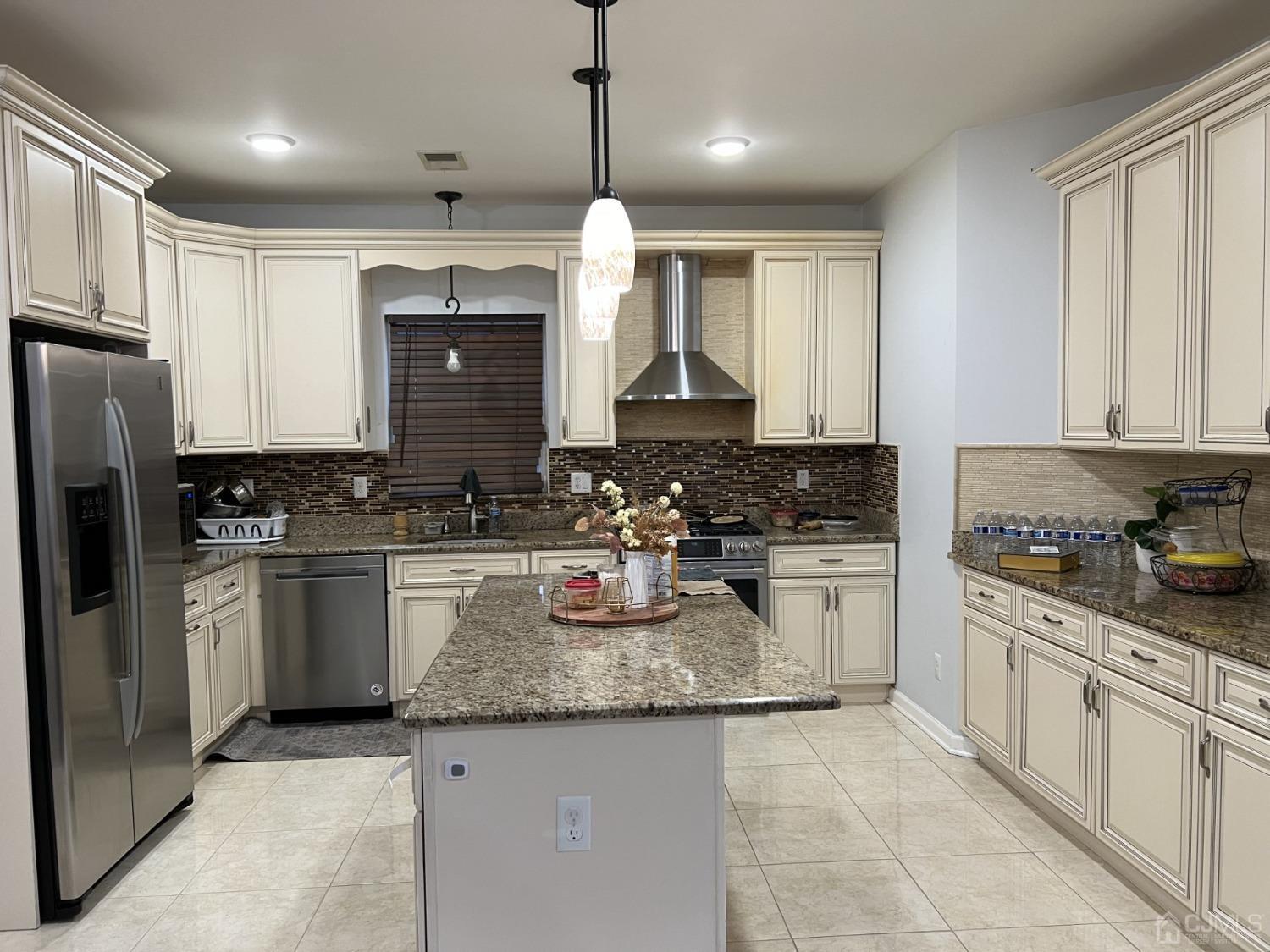 116 B Street Port Reading, NJ 07064 - Photo 5 of 30 a kitchen with granite countertop a sink a counter space stainless steel appliances and cabinets