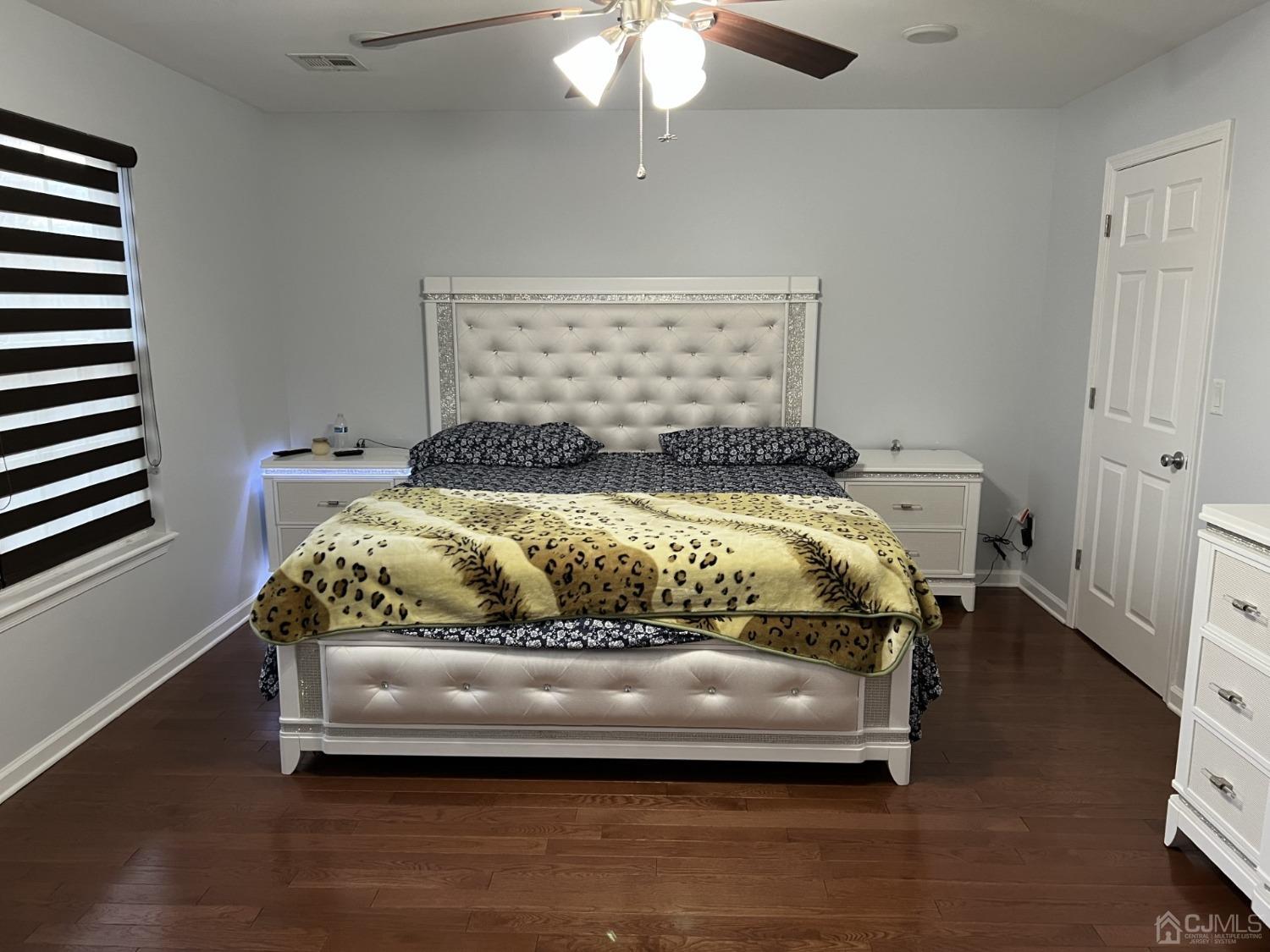 116 B Street Port Reading, NJ 07064 - Photo 8 of 30 a bed sitting in a bedroom next to a window