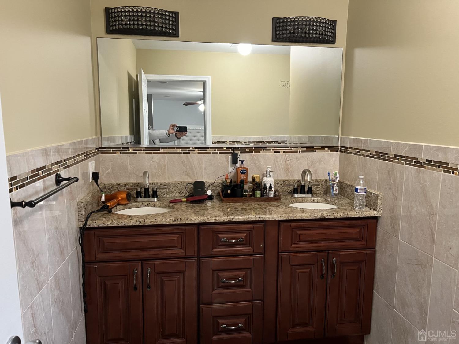 116 B Street Port Reading, NJ 07064 - Photo 10 of 30 a bathroom with a granite countertop sink and a mirror