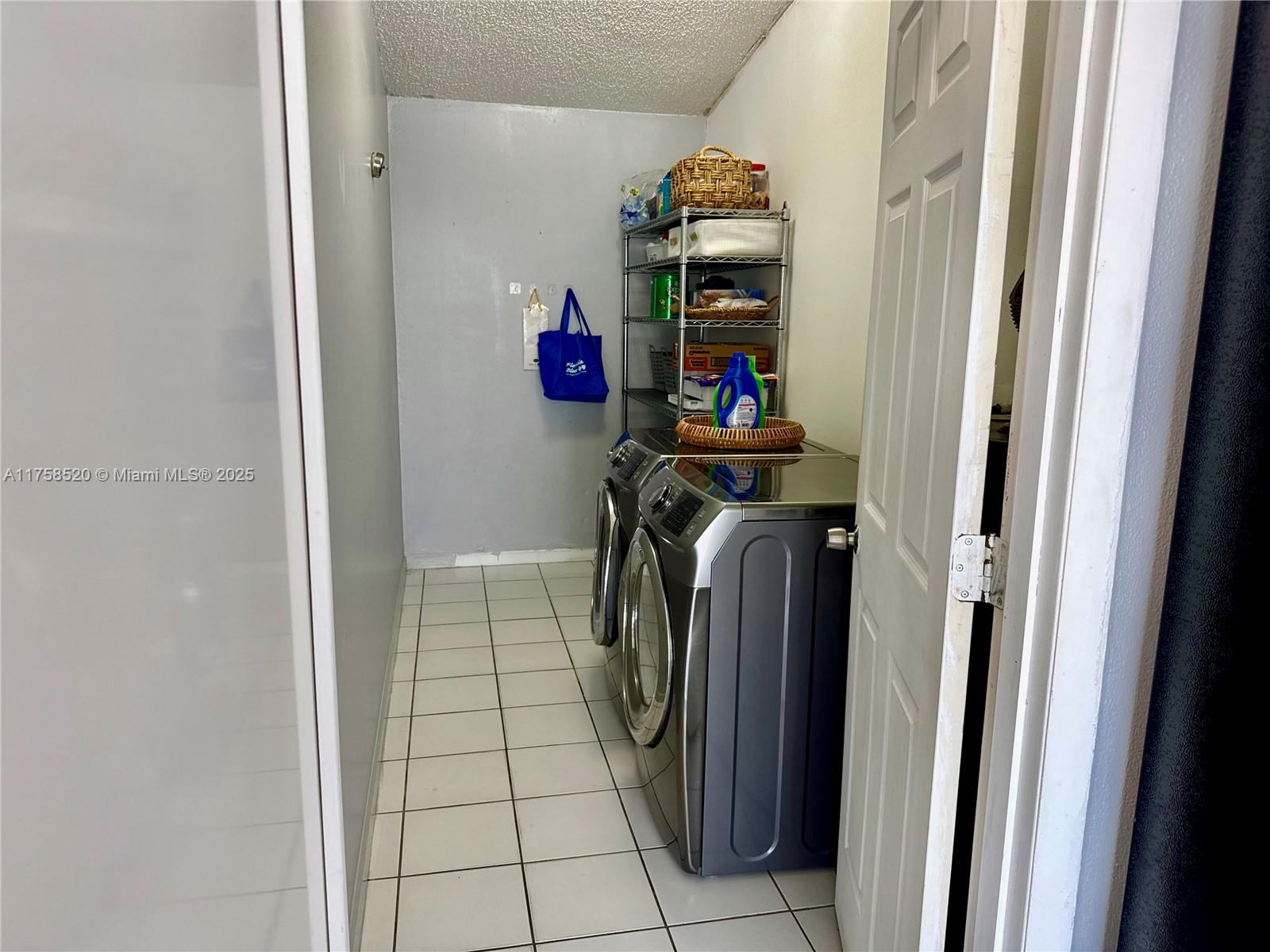 13065 Southwest 263rd Terrace Homestead, FL 33032 - Photo 19 of 19 a utility room with dryer and washer