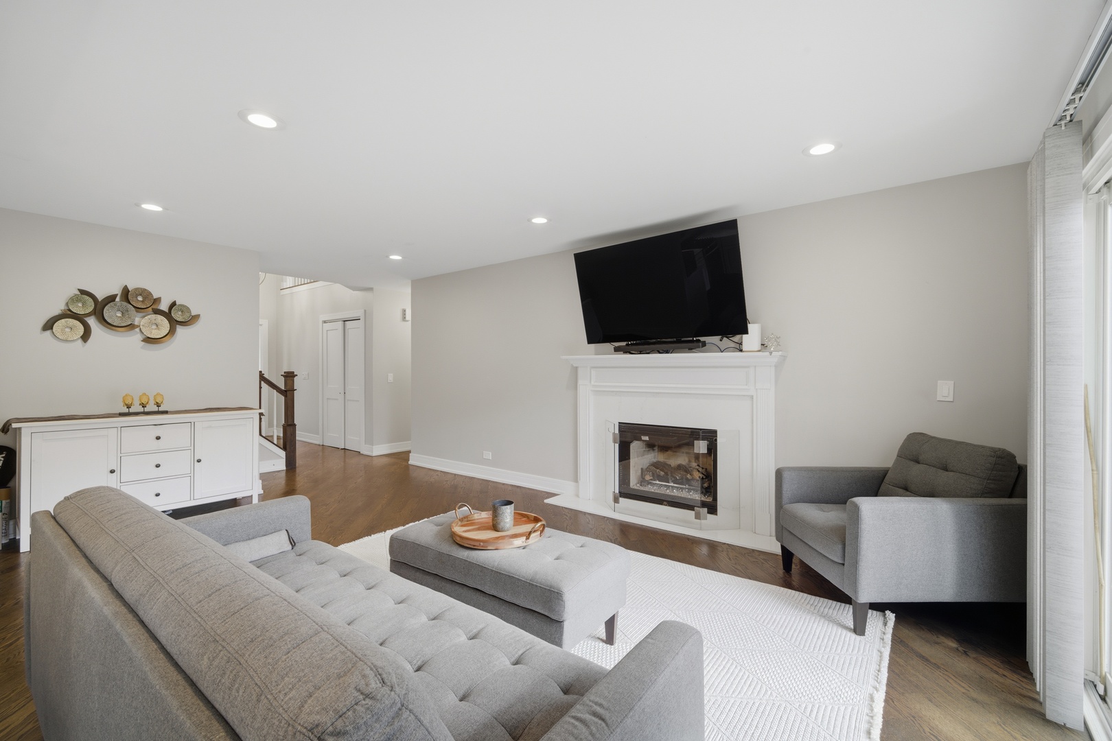 2936 Sandalwood Road Buffalo Grove, IL 60089 - Photo 12 of 40 a living room with furniture a fireplace and a flat screen tv
