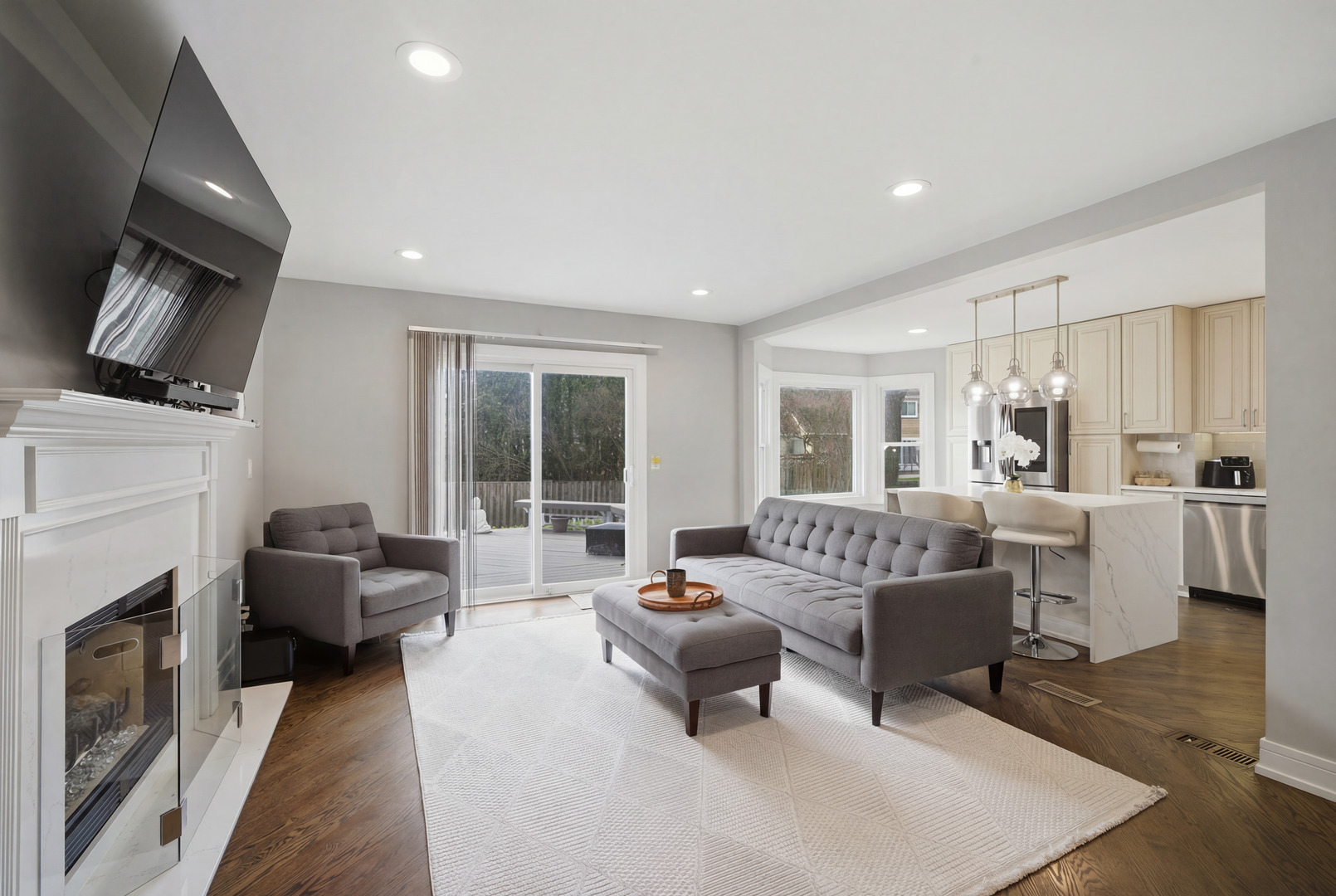 2936 Sandalwood Road Buffalo Grove, IL 60089 - Photo 13 of 40 a living room with furniture a fireplace and a flat screen tv