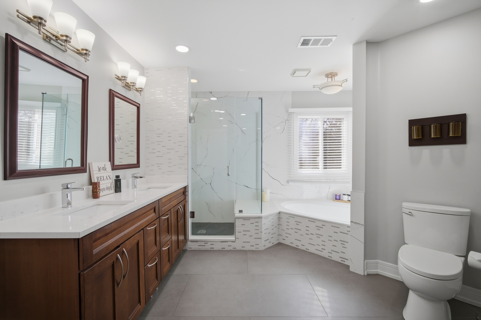 2936 Sandalwood Road Buffalo Grove, IL 60089 - Photo 19 of 40 a bathroom with a double vanity sink toilet and shower