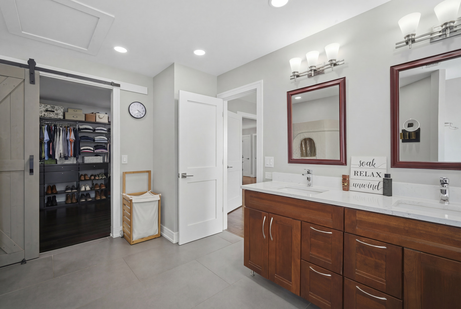 2936 Sandalwood Road Buffalo Grove, IL 60089 - Photo 20 of 40 a spacious bathroom with double vanity a mirror and shower