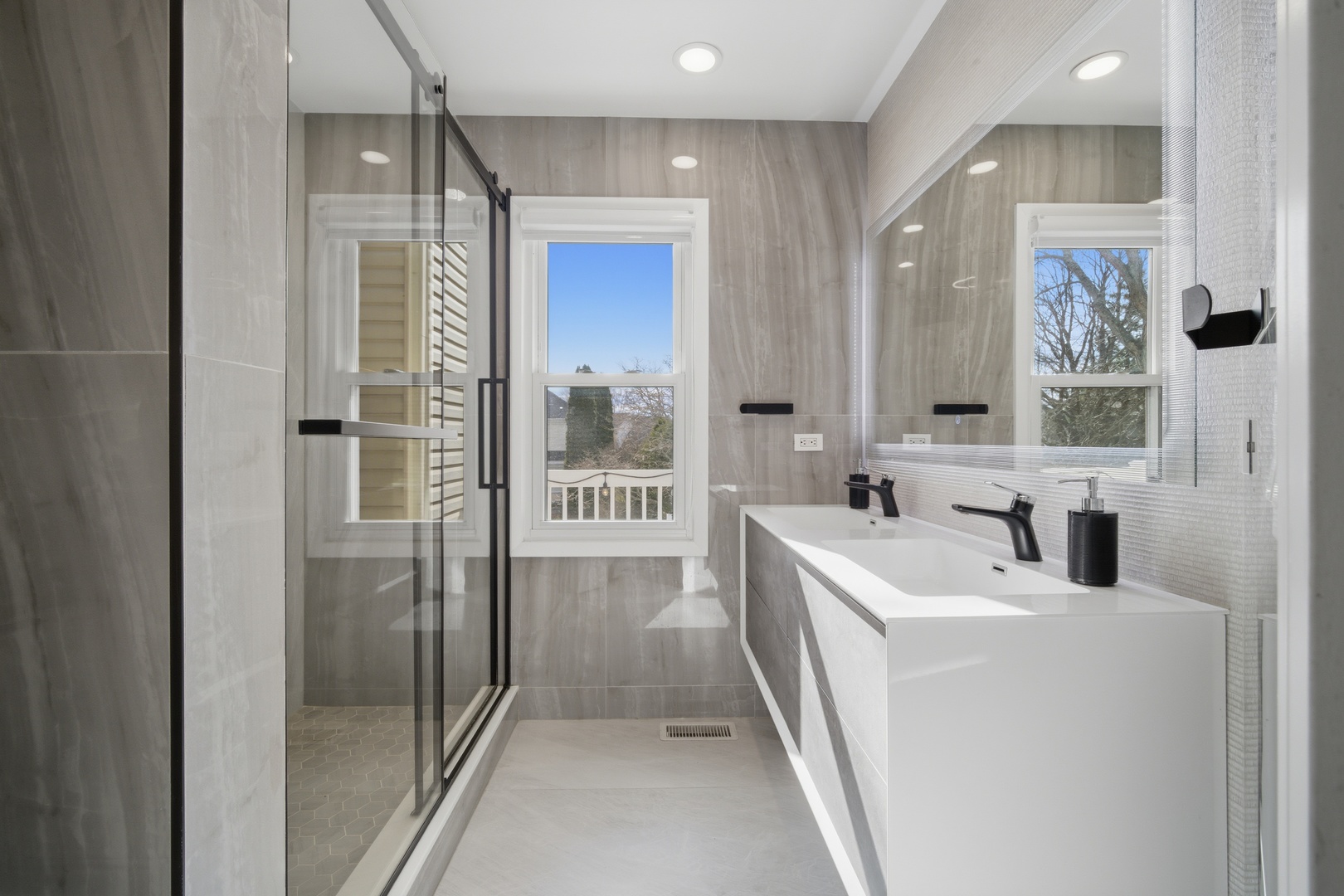 2936 Sandalwood Road Buffalo Grove, IL 60089 - Photo 24 of 40 a bathroom with a tub sink and mirror