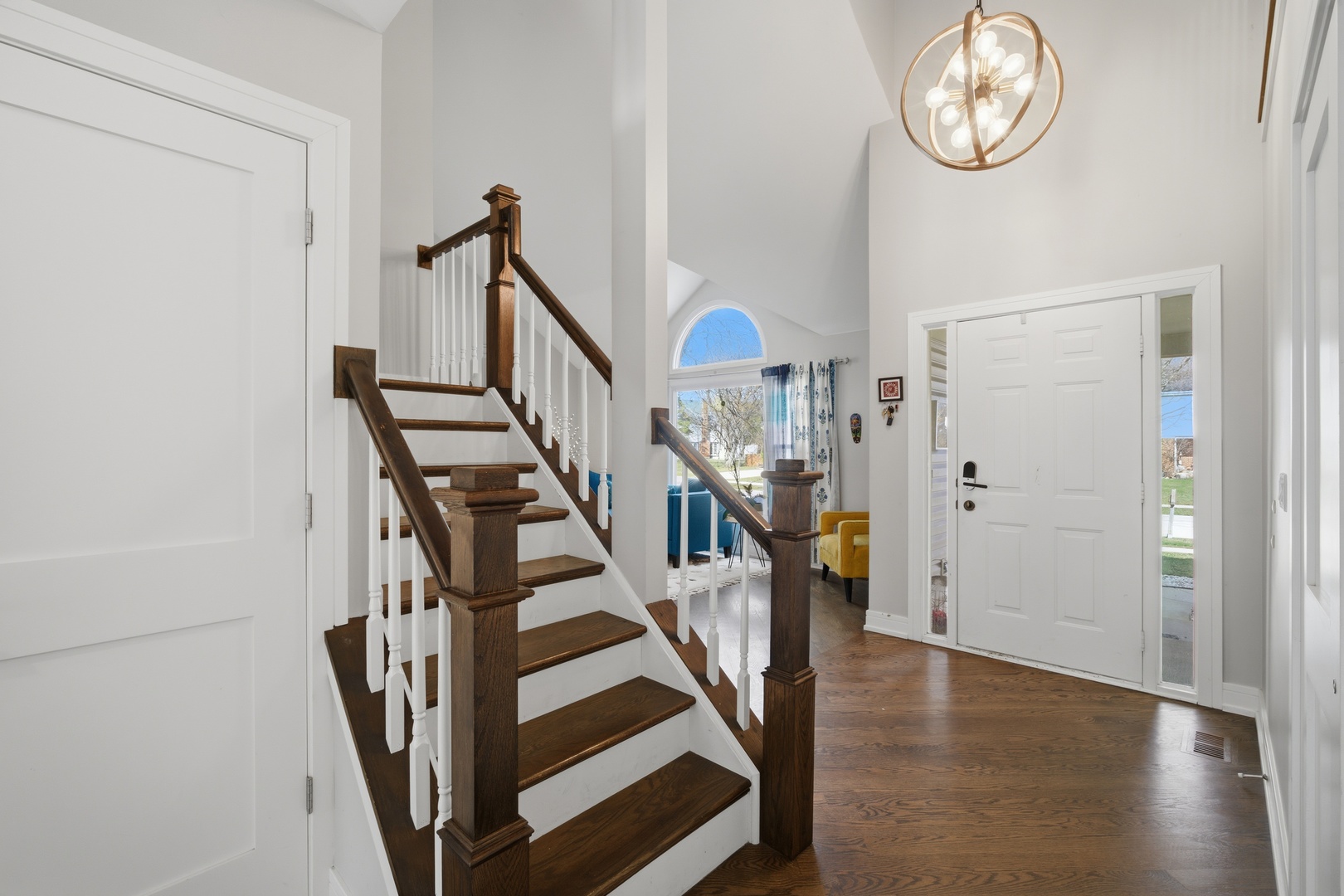 2936 Sandalwood Road Buffalo Grove, IL 60089 - Photo 3 of 40 a view of a hallway with wooden floor and staircase