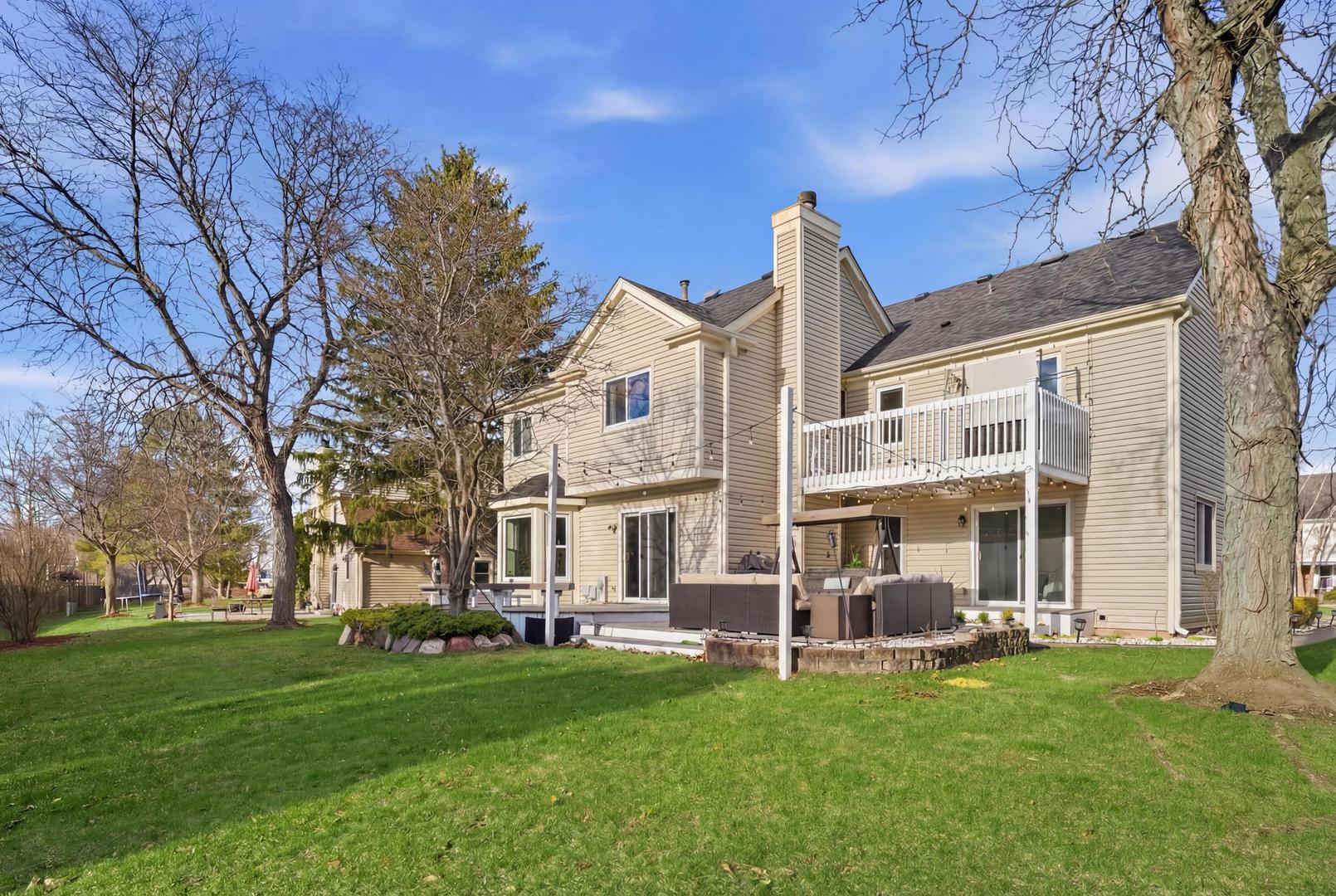 2936 Sandalwood Road Buffalo Grove, IL 60089 - Photo 32 of 40 a view of a house with a yard