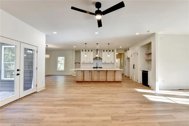 a view of a kitchen with a sink and a window