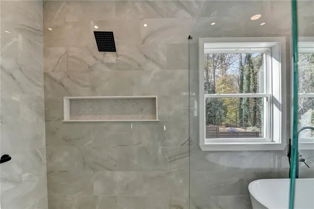 a bathroom with a toilet sink and tub