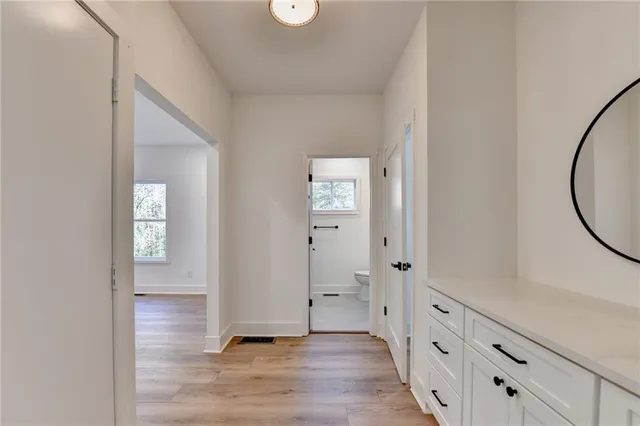 wooden floor with white walls