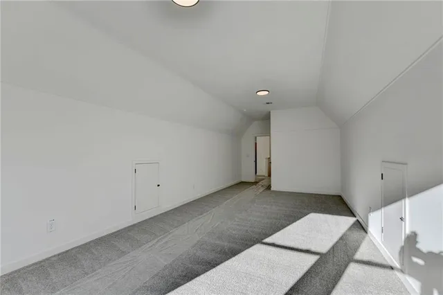 a view of an empty room with windows