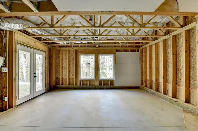 a view of a room with large windows