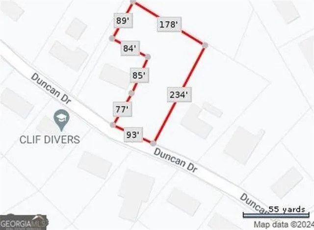 a front view of a house with car parked