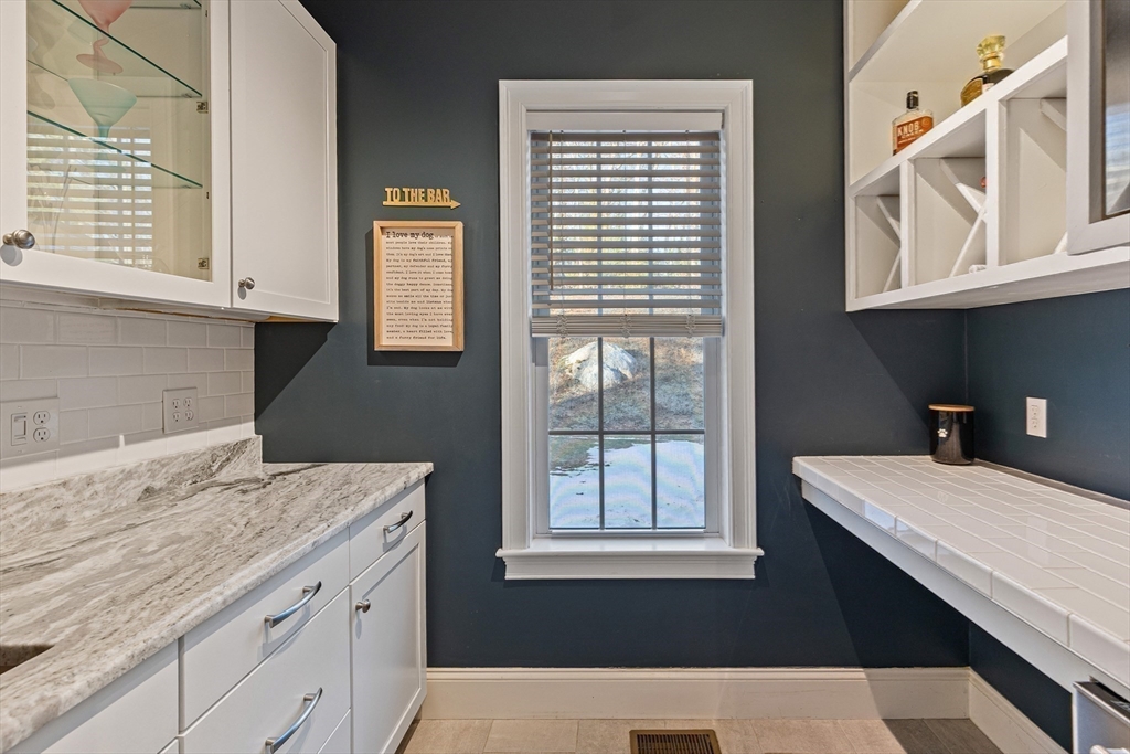 7 Jewell Crossing Mendon, MA 01756 - Photo 11 of 42 a bathroom with a sink cabinets and a window