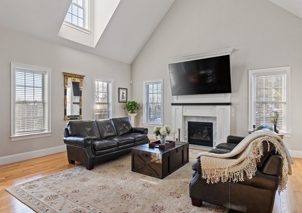 7 Jewell Crossing Mendon, MA 01756 - Photo 15 of 42 a living room with furniture window and a fireplace