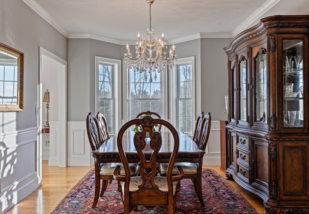 7 Jewell Crossing Mendon, MA 01756 - Photo 17 of 42 a view of a dining room with furniture and chandelier