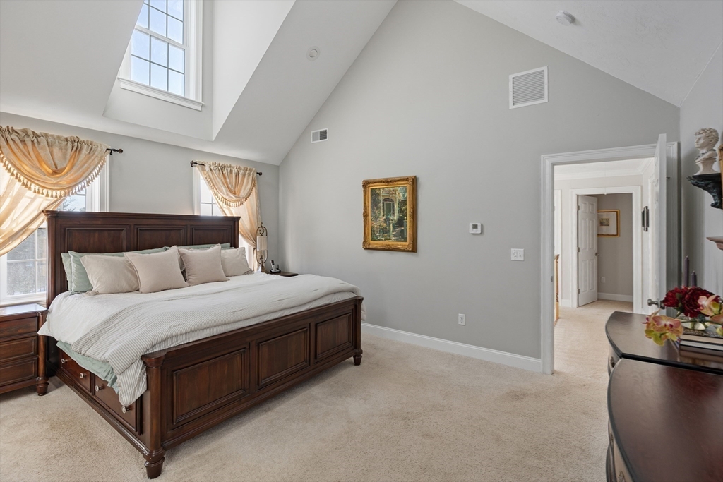 7 Jewell Crossing Mendon, MA 01756 - Photo 21 of 42 a spacious bedroom with a bed and a couch