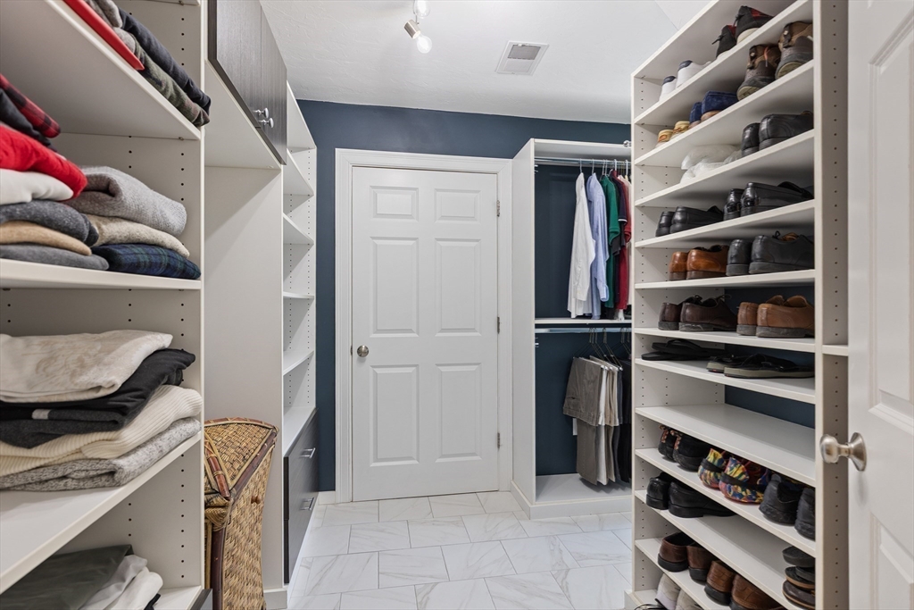 7 Jewell Crossing Mendon, MA 01756 - Photo 23 of 42 a view of walk in closet with empty racks