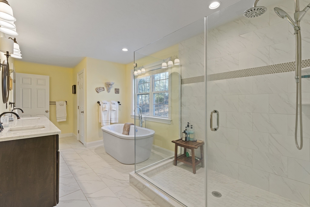 7 Jewell Crossing Mendon, MA 01756 - Photo 25 of 42 a spacious bathroom with a bathtub and a sink