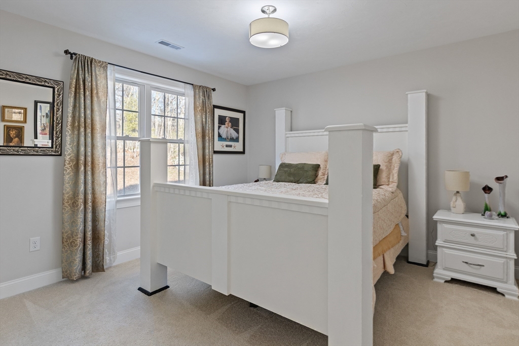 7 Jewell Crossing Mendon, MA 01756 - Photo 29 of 42 a room with a bed and a window