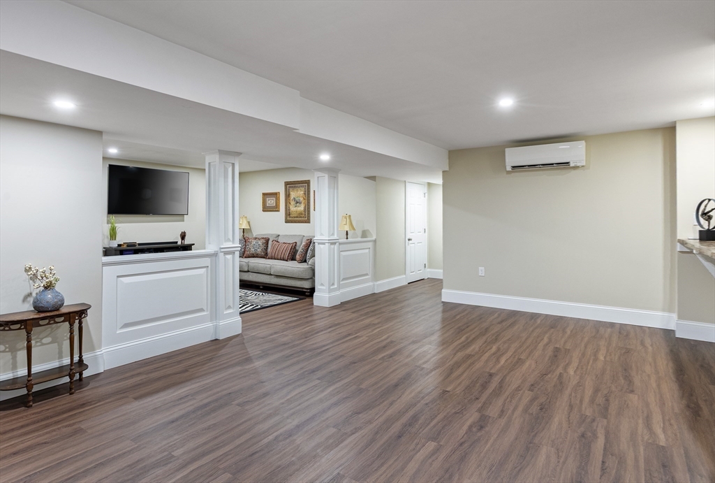 7 Jewell Crossing Mendon, MA 01756 - Photo 33 of 42 a view of a livingroom with furniture and a flat screen tv