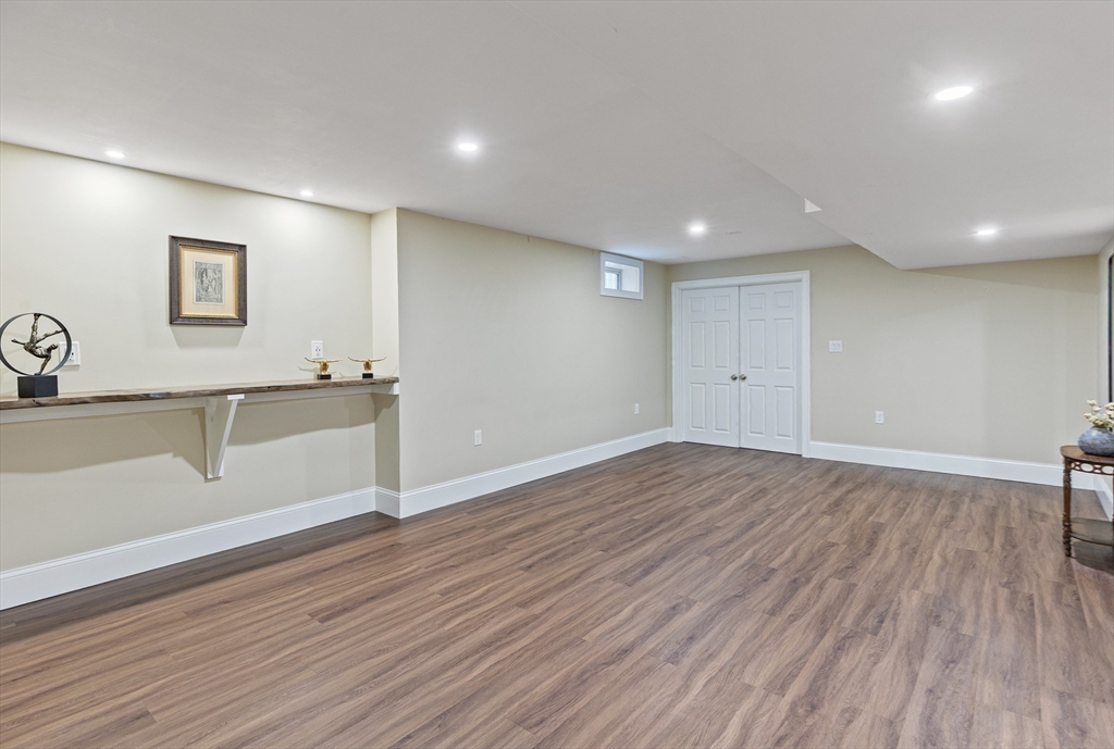 7 Jewell Crossing Mendon, MA 01756 - Photo 34 of 42 a view of a big room with wooden floor