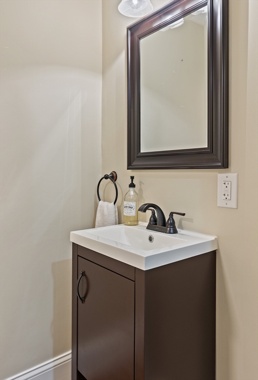 7 Jewell Crossing Mendon, MA 01756 - Photo 35 of 42 a bathroom with a sink and a mirror