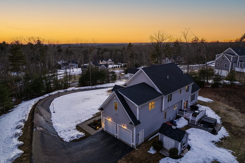 7 Jewell Crossing Mendon, MA 01756 - Photo 40 of 42 an aerial view of a house with a yard