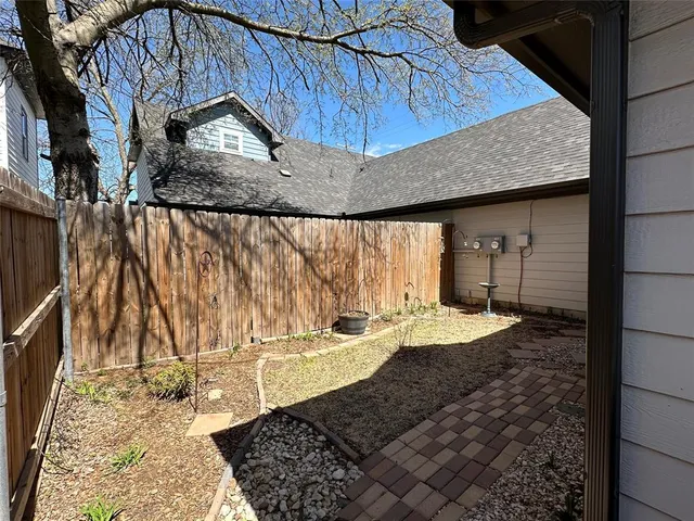 a view of a back yard of the house