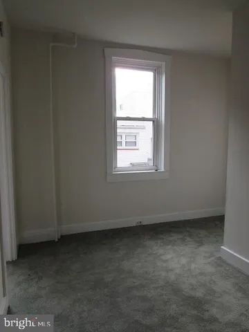 a bathroom with a sink a toilet a mirror and shower