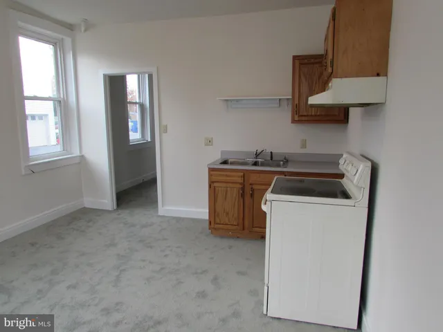 a room with a sink and a mirror