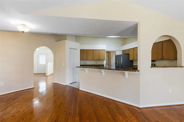 a view of a livingroom with furniture and wooden floor