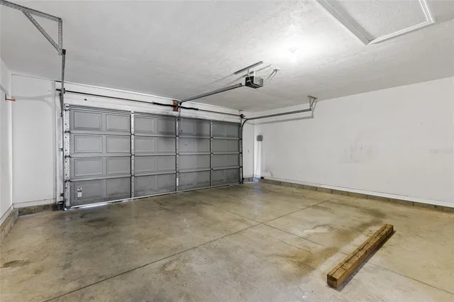 a view of porch with a table and chairs