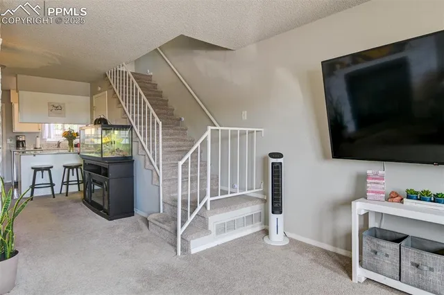 a view of entryway with a flat screen tv and windows