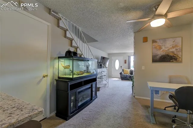 a living room with furniture and a table
