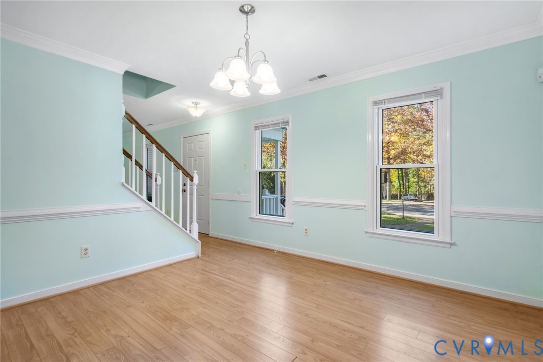 2411 Arrowood Road Midlothian, VA 23112 - Photo 11 of 34 a view of an empty room with wooden floor and a window