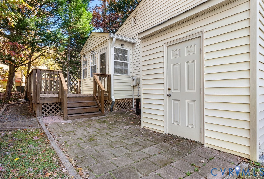 2411 Arrowood Road Midlothian, VA 23112 - Photo 23 of 34 a view of a house with backyard and wooden fence