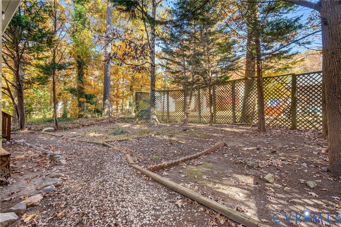 2411 Arrowood Road Midlothian, VA 23112 - Photo 25 of 34 a backyard of a house with lots of green space