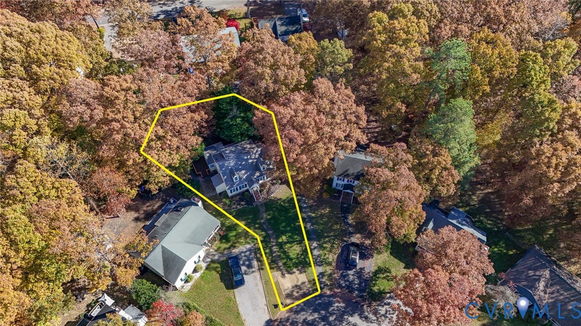 2411 Arrowood Road Midlothian, VA 23112 - Photo 31 of 34 a backyard of a house with lots of trees