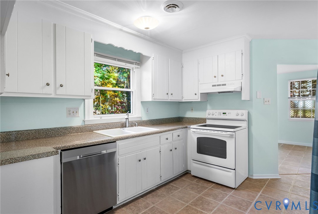2411 Arrowood Road Midlothian, VA 23112 - Photo 8 of 34 a kitchen with granite countertop white cabinets and window