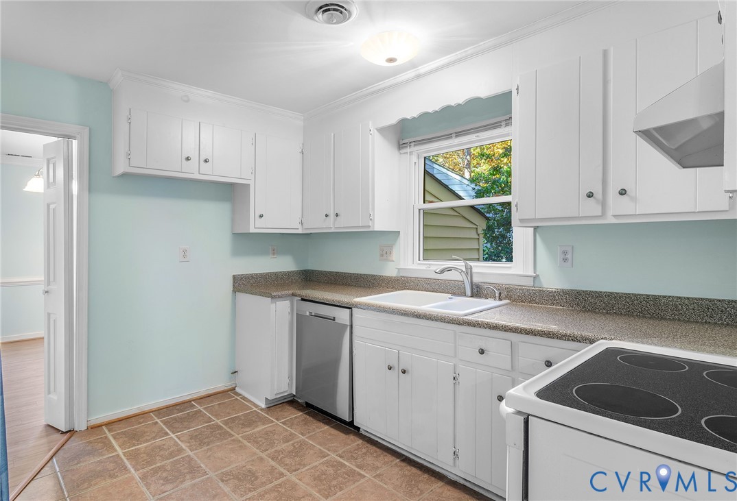 2411 Arrowood Road Midlothian, VA 23112 - Photo 9 of 34 a kitchen with a sink cabinets and window